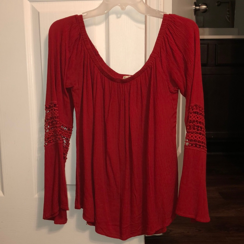 Dark orange long sleeve shirt.